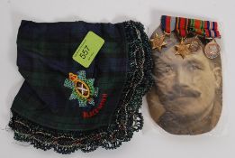 Minature WWI medal group for Edward Castle along with a photo of Mr Castle along with a tartan