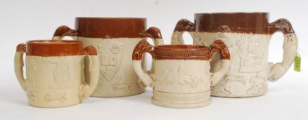 A collection of 4  large stoneware twin handled loving cups - jugs having hunting scenes with