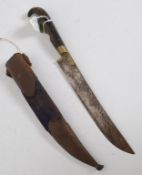 An Indian horn handled dagger set within velvet scabbard having steel mounts applied with koftgari