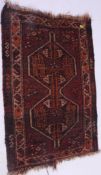 An Islamic handwoven Persian rug having geometric borders with central elongated medallion motif