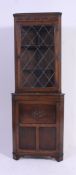 A Jaycee leaded glass quality oak Jacobean revival corner cabinet.