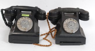 A pair of 1950's bakelite vintage telephones having ring dial and undertrays marked 332L & 332 G3