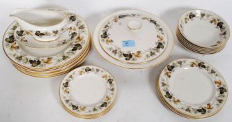 A Royal Doulton part dinner service in the Larchmont pattern consisting of plates, bowls,