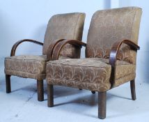 A pair of 1930's Art Deco bridge armchairs having bentwood shaped elbow rests with upholstered