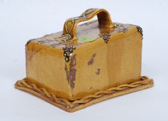A late 19th century slipware cheese dish.