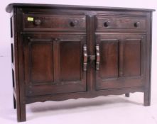 An Ercol Jacobean beech and elm wood dresser sideboard.