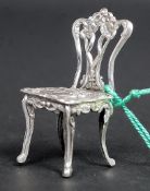 A good white metal (stamped 925 for silver ) model of a Hepplewhite / Chippendale style dining