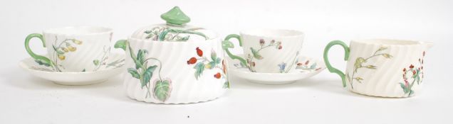 A beautiful Mintons leadless glaze chintz pattern tea for 2 service comprising 2 cups and saucers,