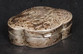 A silver scalloped form pill / snuff pot, having a hinged chased decorated lid,