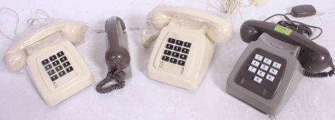 A pair of vintage 1970's retro BT push button cream telephones together with a similar finished in