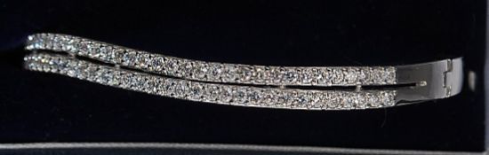 A silver white metal 925 two row white stone cz bangle bracelet.
