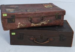 2 vintage 20th century gentlemans suitcases, one being canvas, the other faux brown leather,