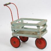 A vintage childs three wheeled handled wooden and metal cart.