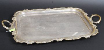 A good quality silver plate ( on brass ) butlers serving tray salver of large form having rococo