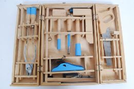 A vintage childs cased carpentry / wood working set, to include saw, hammer,