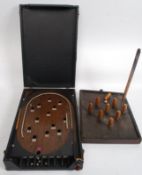 A good 1930's pinball bagatelle game, within the original case, along with a table skittles set.