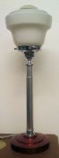 A vintage Art Deco lamp, standing on original stepped circular base,