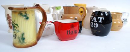 A good collection of vintage 20th century ceramic whisky jugs to include Haig, VAT69, Bells,