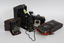 A  vintage Russian ROM 3 bellows camera together with a Nettar folding portable bellows camera in