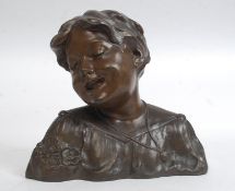 A 20th century large hollow cast bronze bust - study of a young laughing boy ( see illustrations )