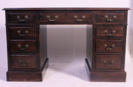 An Edwardian mahogany twin pedestal office desk.