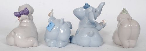 A collection of Nao figurines,