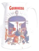A vintage advertising jug for Guinness, having a all the Guinness animals in a comical scene,