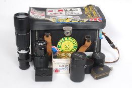 A collection of camera lenses to include a Vivitar Series 1 70 - 210mm zoom lens,