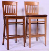 2 x  20th century upholstered chunky beechwood bar stools, one with brown leather,