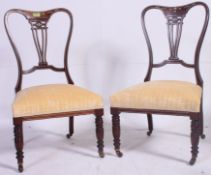 A Pair of ( 2 ) Victorian rosewood, mahogany and marquetry inlaid nursing chairs.