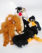 An oversized stuff toy in the form of Sylvester The Cat, A large Daffy Duck hot water bottle holder,