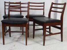 A set of 4 1970's Danish solid teak wood dining chairs.