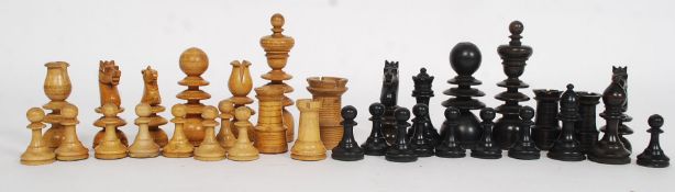 A vintage early 20th century chess set in the manner of William Lund complete in the wooden box