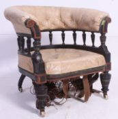 A Victorian aesthetic movement faux cream leather armchair.