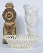 A Troika style vase / lamp base together with a ceramic art deco vase in the form of a lady (