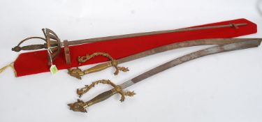 A pair of 20th century gilt Indian decorative swords,
