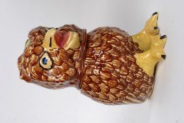 An early - mid 20th century Devon style tobacco jar in the form of a bird.