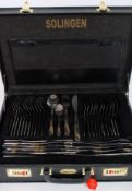A 20th century cased canteen of cutlery by Solingen. Complete in the original briefcase display.
