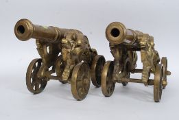 A pair of large heavy matching desk cannons, with scrolling dragon design support,