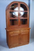 A 20th century large quality Danish upright display cabinet by Dyrlund bearing labels to verso.
