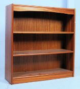A good 1970's solid teak Danish open window bookcase  having inset plinth with central open window
