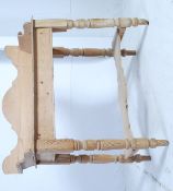 A Victorian country pine washstand - side table being raised on turned legs with the top having
