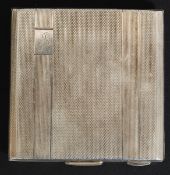 A hallmarked silver ladies makeup compact, with chase engraving to exterior. H7cm.; 91.