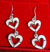 A pair of silver and enamel set double heart drop earrings. Stamped 925.