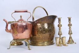 A collection of vintage brass wares to include a coal scuttle along with a raised trivet stand,