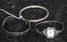 A collection of silver 925 / sterling ladies bangles / bracelets to include rope twist,