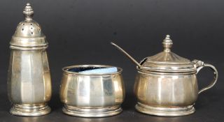 A hallmarked silver condiment set, with hallmarks to the base.