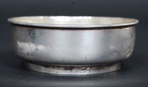 A silver hallmarked dish bearing shipping line flag to inner centre.