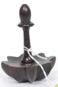 A late 18th century treen citrus press fruit squeezer having finial topped stem