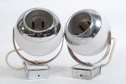A pair of vintage / retro eyeball lights in white having adjustable  circular orb shades.